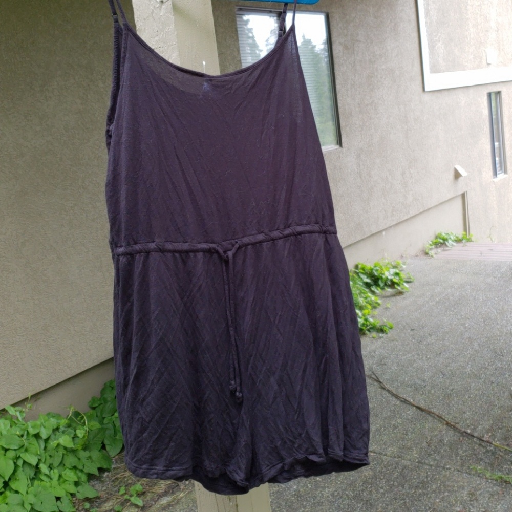 Flowy black romper with tie waist